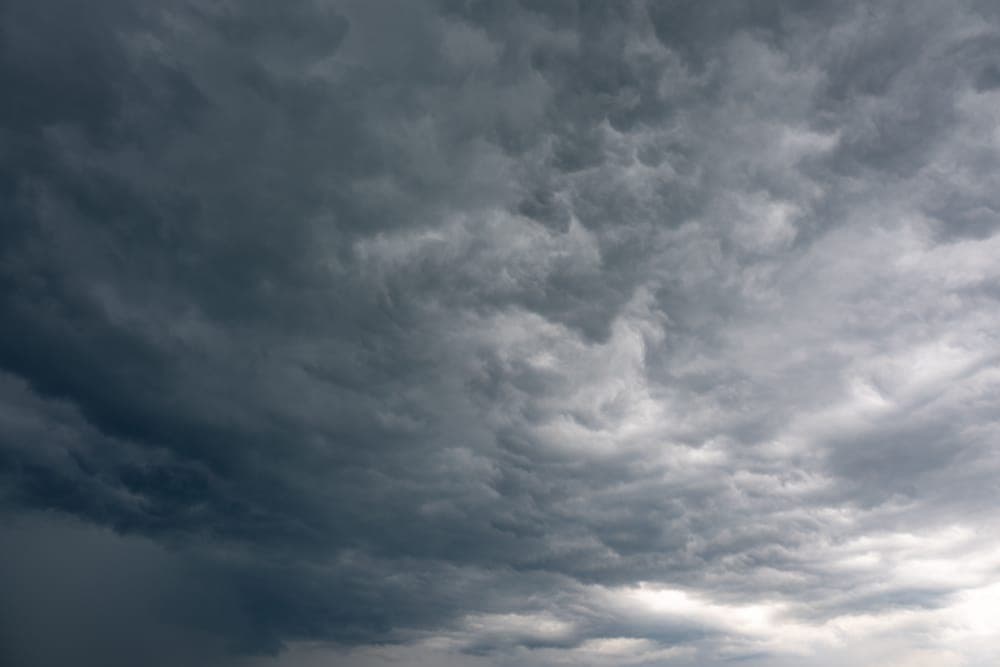 Dark storm clouds building over open country